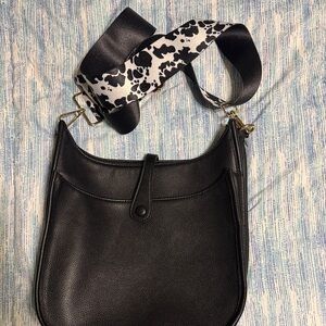 Elegant Black Crossbody Bag with Printed Strap